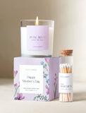 Lit "Petal Blush" candle in glass, on a floral "Happy Mother's Day" box, with a clear tube of matches. - Image 