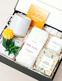 Open gift box filled with curated gifts. - Image 