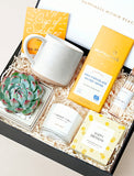 Open gift box filled with curated gifts. - Image 