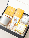 Open gift box filled with curated gifts. - Image 