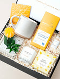 Open gift box filled with curated gifts. - Image 