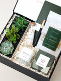 Open gift box filled with curated gifts.