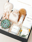 Open gift box filled with curated gifts.