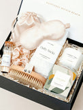 Open gift box filled with curated gifts.