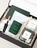 Open gift box filled with curated gifts.