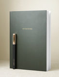 Green notebook and pen. - Image 