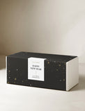 Black rectangular gift box with gold star accents and a white Happy New Year label for a succulent garden. - Image 
