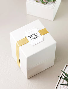 Gift box wrapped in "You Did It!" top tag.