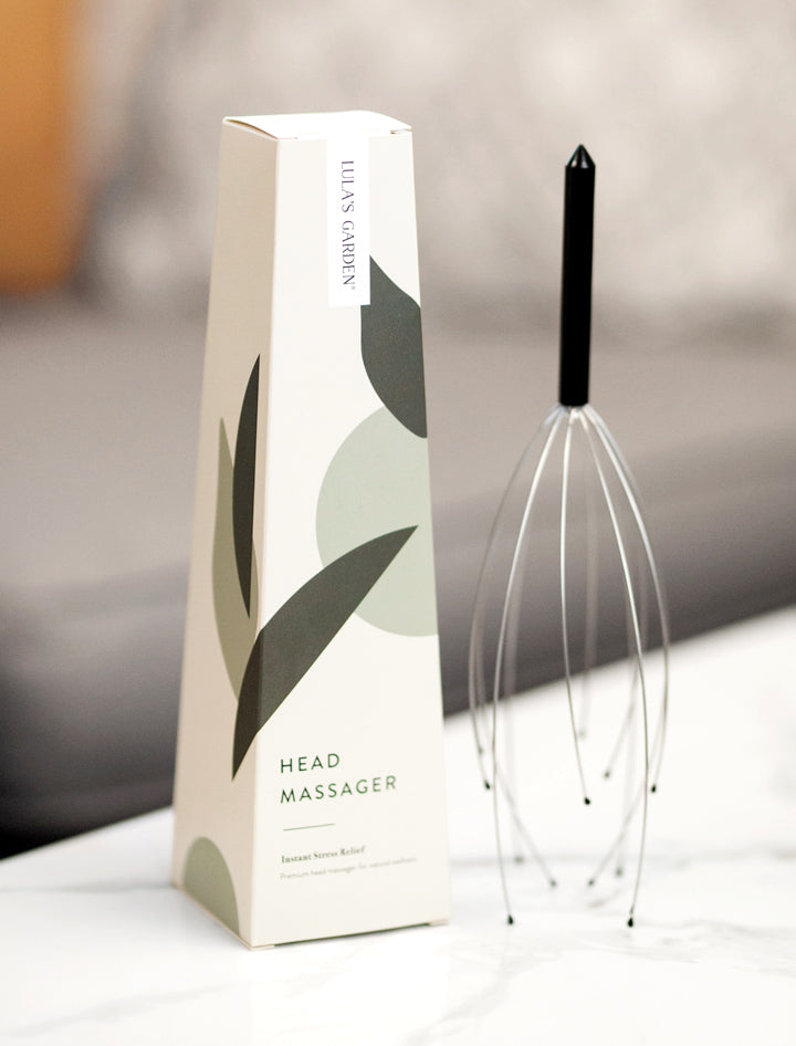 Head Massager and Box on Table.