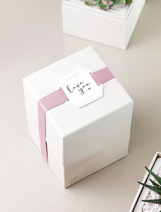 Gift box wrapped in "Love You" top tag.
